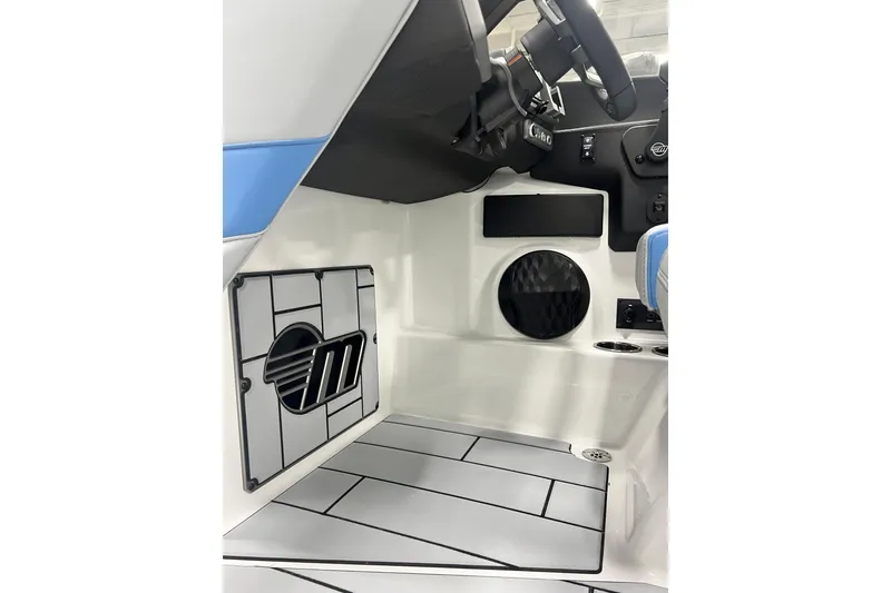 Slide: The Image of 2024 Malibu Wakesetter 24 MXZ interior cockpit with steering wheel and modern design. - 13