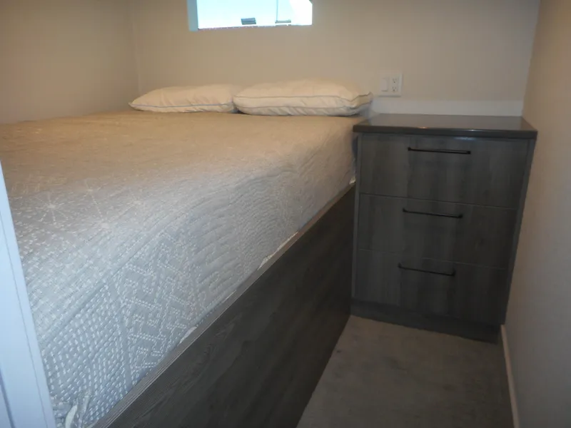 Slide: The Image of Compact bedroom in Adonia Obsession Trip #12, 2021 model, featuring a bed and storage drawers. - 11