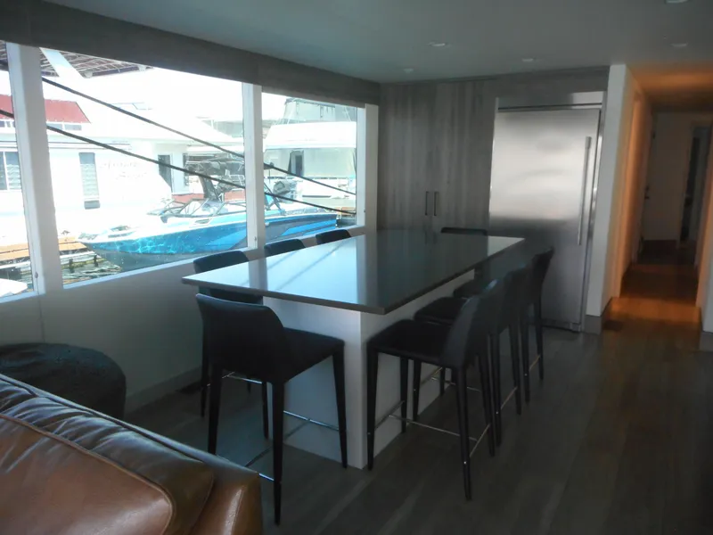 Slide: The Image of Modern kitchen interior on Adonia Obsession Trip #12 houseboat, featuring sleek design and large windows. - 21