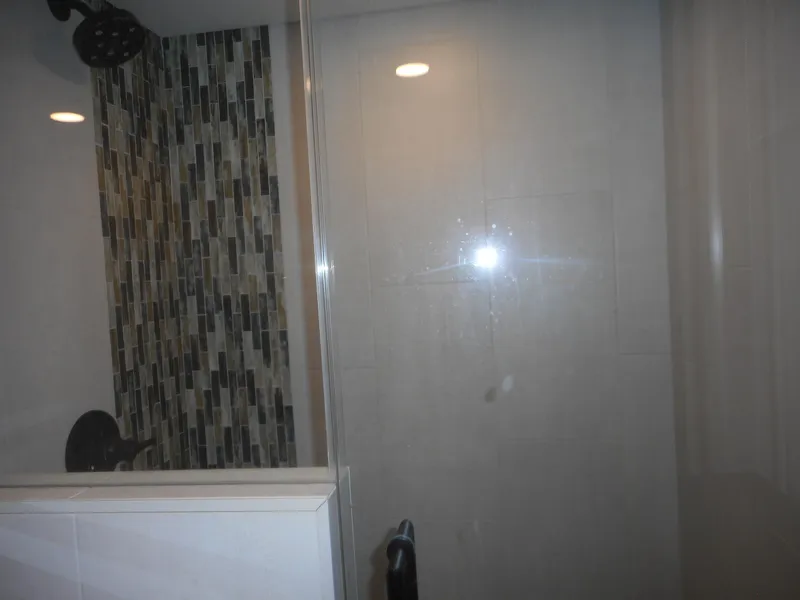 Slide: The Image of Modern shower with mosaic tile wall and glass door, Adonia Obsession Trip #12, 2021. - 27