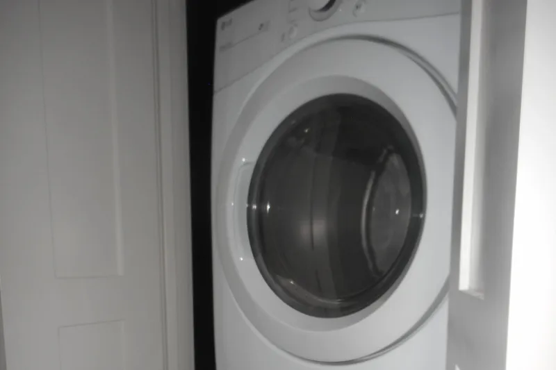 Slide: The Image of Front-loading washing machines in a laundry room, Adonia Obsession Trip #12, 2021 model. - 32