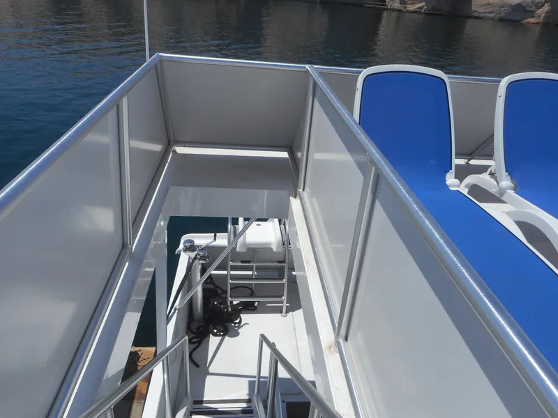 Slide: The Image of Stairway on Adonia Obsession Trip #12 boat, 2021, with blue seating and ocean view. - 37