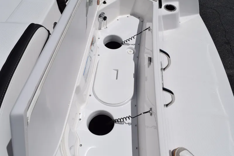 Slide: The Image of Yamaha Boats 255 FSH Sport H 2026, storage and seating area. - 10