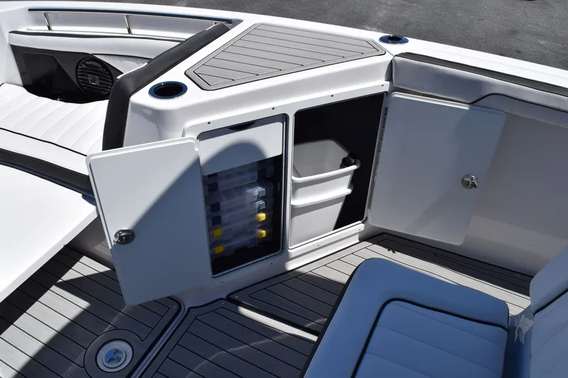 Slide: The Image of Yamaha Boats 2026 255 FSH Sport H with storage and seating area. - 22