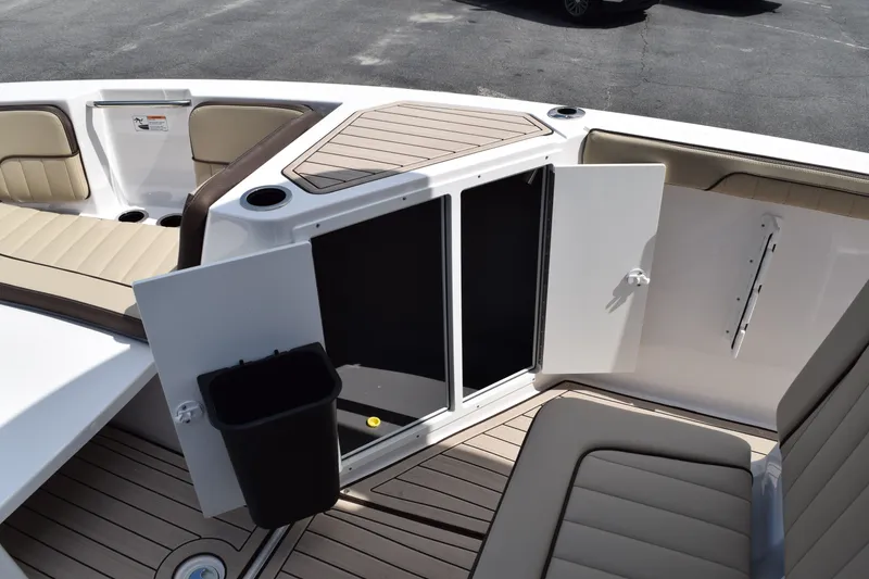 Slide: The Image of Interior of Yamaha Boats 222FSH SP E 2026 with storage and seating. - 15
