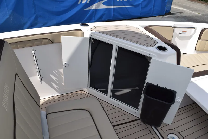 Slide: The Image of Interior of Yamaha Boats 222FSH SP E 2026 with storage compartment. - 16