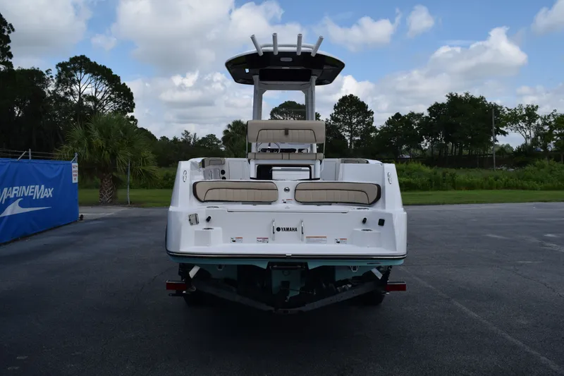 Slide: The Image of Rear view of Yamaha Boats 222FSH SP E 2026 on a parking lot. - 2