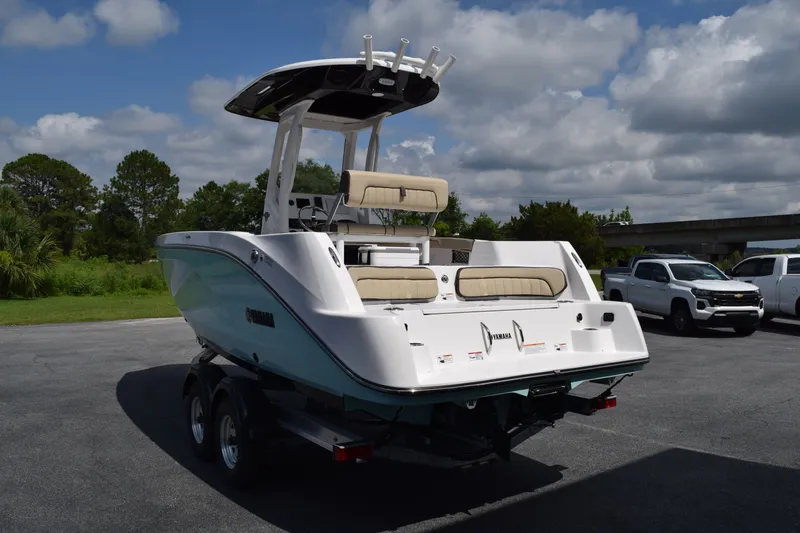 Slide: The Image of 2026 Yamaha Boats 222FSH SP E on trailer, parked outdoors. - 3