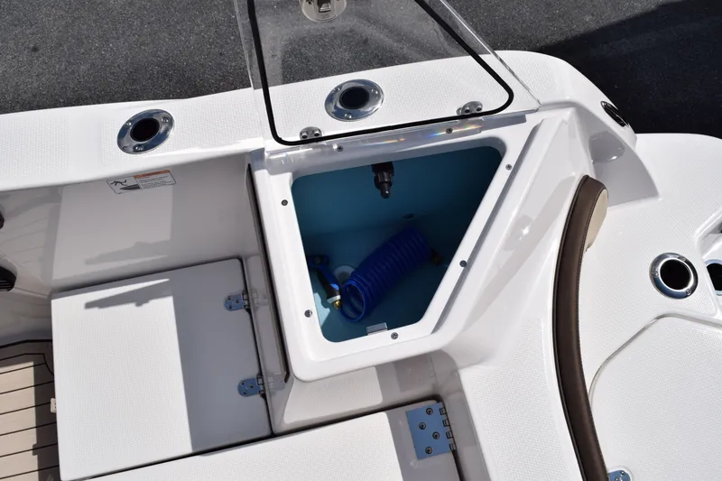 Slide: The Image of Yamaha 222FSH SP E 2026 boat with open storage compartment. - 7