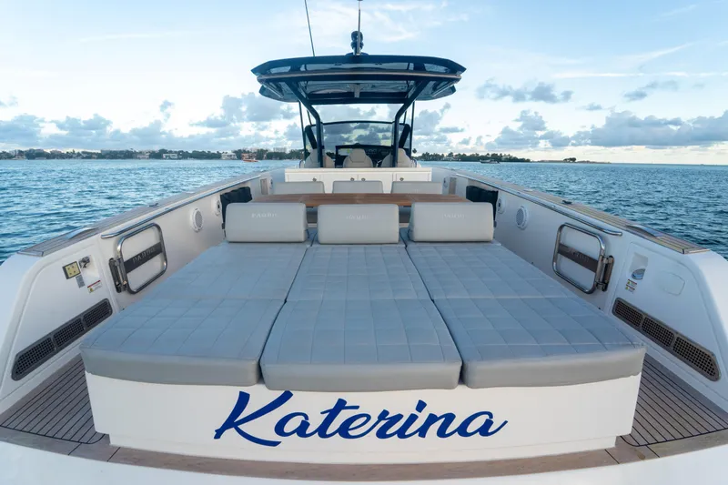Slide: The Image of 2021 Pardo Yachts 43 with sunbeds, named "Katerina," on a serene ocean backdrop. - 12