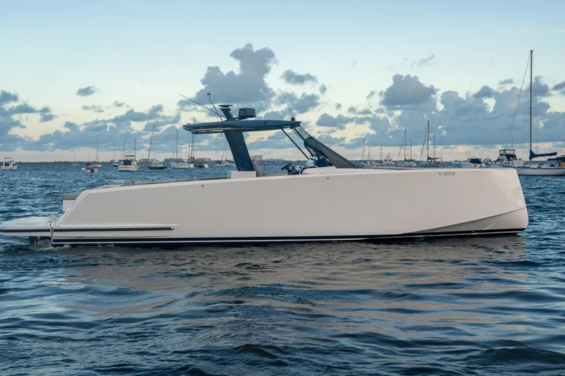 Slide: The Image of 2021 Pardo Yachts 43 on calm water, sleek design, cloudy sky background. - 2