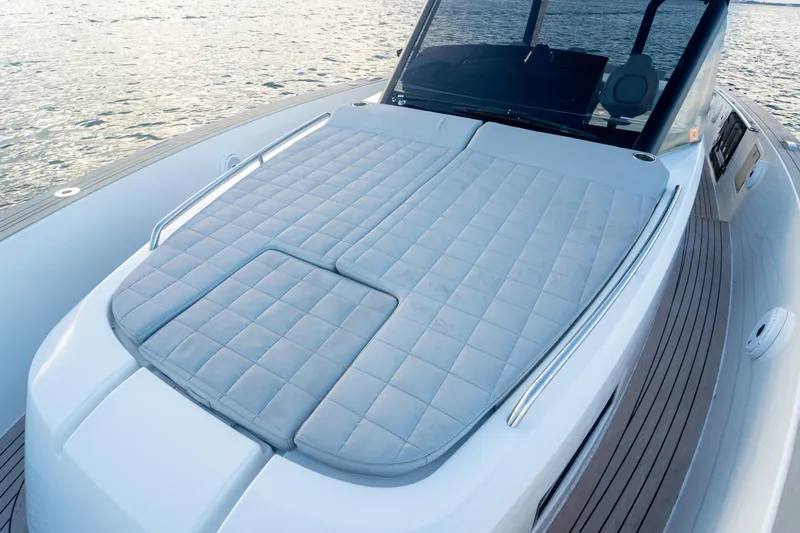 Slide: The Image of 2021 Pardo Yachts 43 with spacious sunbed on deck, overlooking serene waters. - 25