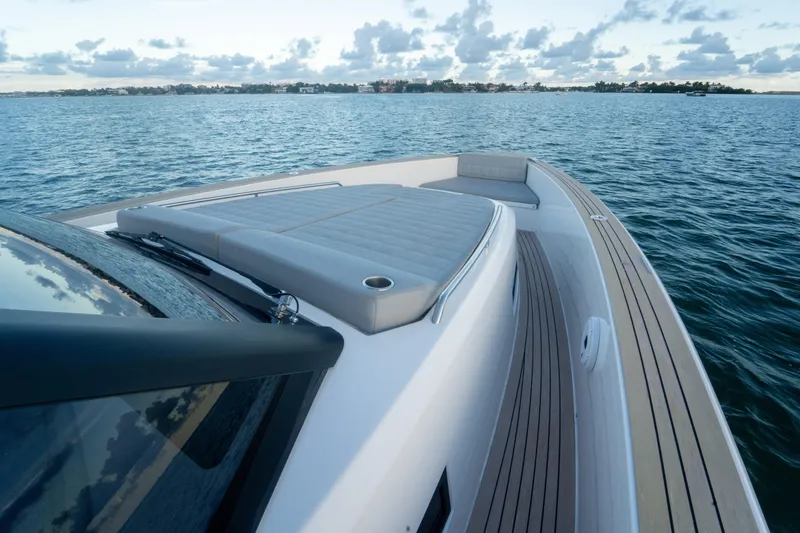 Slide: The Image of 2021 Pardo Yachts 43 on calm water, featuring sleek deck design and luxurious seating. - 26