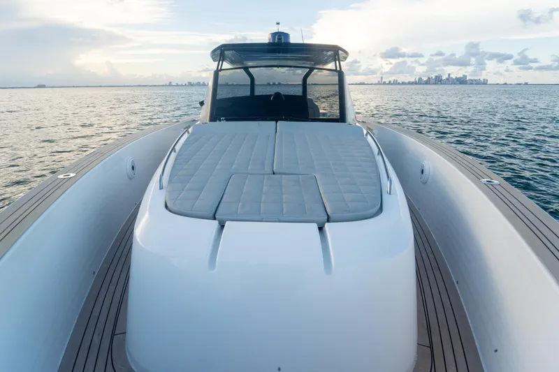 Slide: The Image of Luxury Pardo Yachts 43, 2021 model, cruising on serene waters with city skyline. - 27