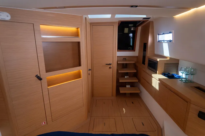 Slide: The Image of Luxurious interior of 2021 Pardo Yachts 43, featuring modern wood finishes and ambient lighting. - 29