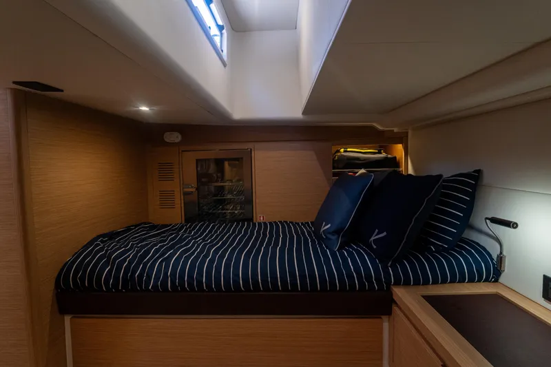 Slide: The Image of Interior cabin of 2021 Pardo Yachts 43 with striped bedding and modern design. - 32