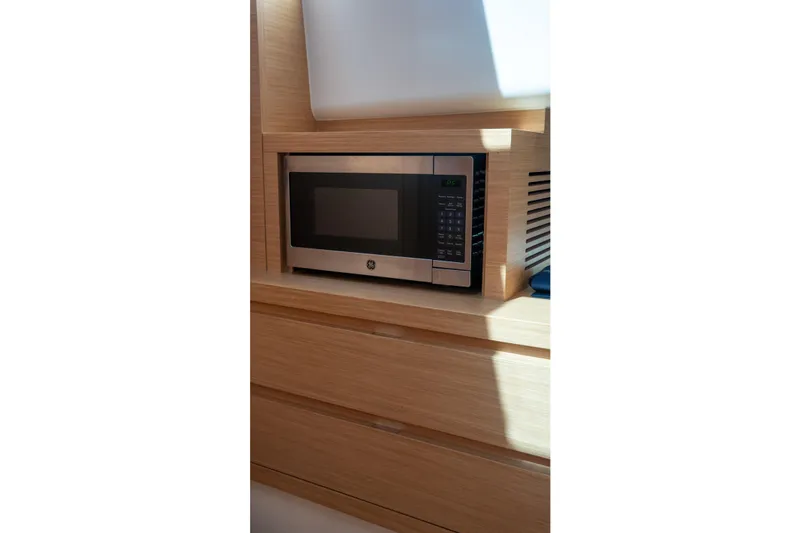 Slide: The Image of Microwave in Pardo Yachts 43, 2021 model, wooden cabinetry. - 35
