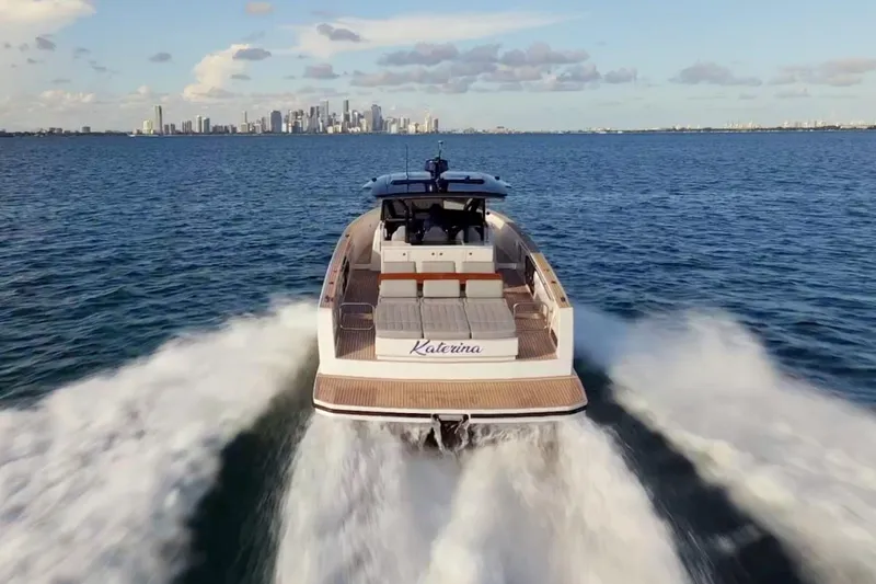 Slide: The Image of 2021 Pardo Yachts 43 cruising on open water with city skyline in background. - 4
