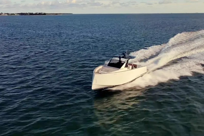 Slide: The Image of 2021 Pardo Yachts 43 cruising on open water, creating a dynamic wake. - 6