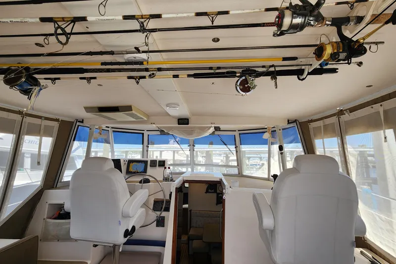 Slide: The Image of Interior of 2003 Endeavour 44 TrawlerCat with fishing rods and navigation equipment. - 11