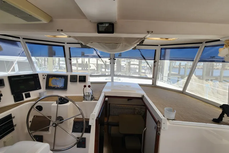 Slide: The Image of Helm of 2003 Endeavour 44 TrawlerCat with navigation equipment and panoramic windows. - 16
