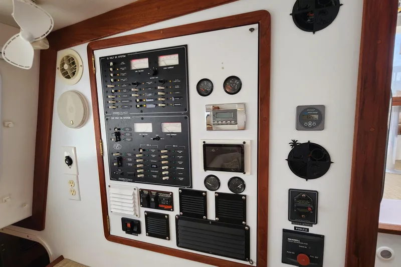 Slide: The Image of Control panel of a 2003 Endeavour 44 TrawlerCat with gauges and switches. - 44