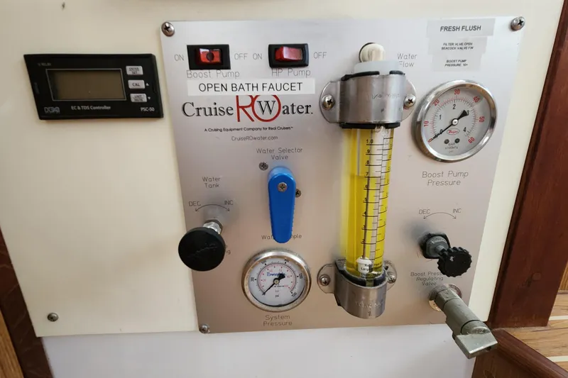 Slide: The Image of Control panel of a 2003 Endeavour 44 TrawlerCat water system with gauges and valves. - 49