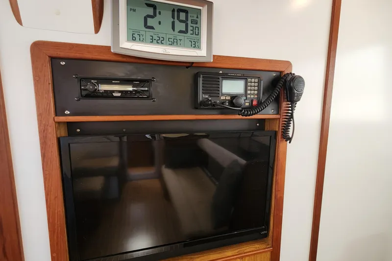 Slide: The Image of Control panel of 2003 Endeavour 44 TrawlerCat with clock, radio, and TV. - 50