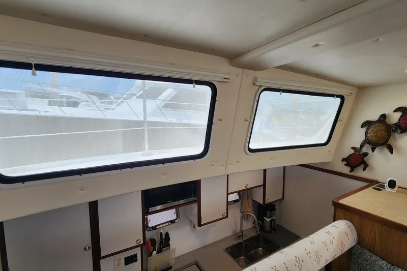 Slide: The Image of Interior of 2003 Endeavour 44 TrawlerCat with kitchen and decorative wall art. - 54