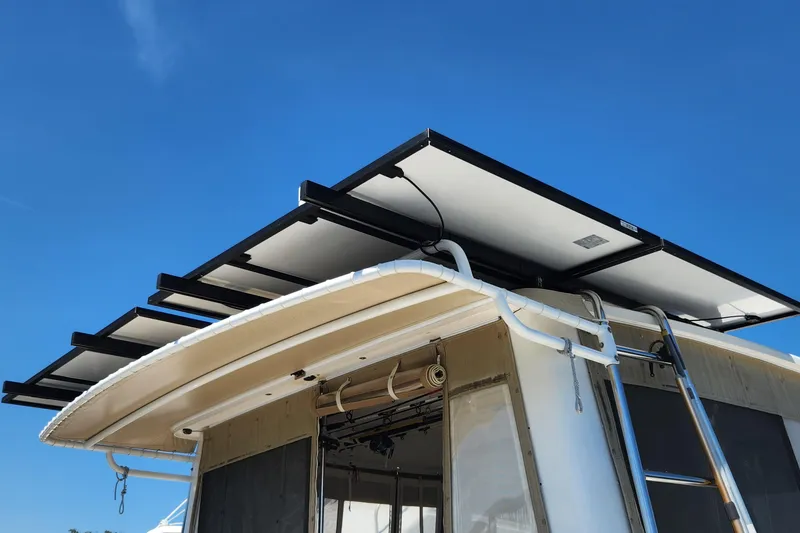 Slide: The Image of Solar panels on a 2003 Endeavour 44 TrawlerCat under a clear blue sky. - 65