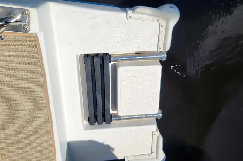 Slide: The Image of Swim platform ladder on a 2003 Endeavour 44 TrawlerCat, partially submerged in water. - 66