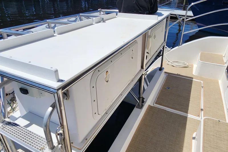 Slide: The Image of 2003 Endeavour 44 TrawlerCat deck with storage compartments and railing. - 7