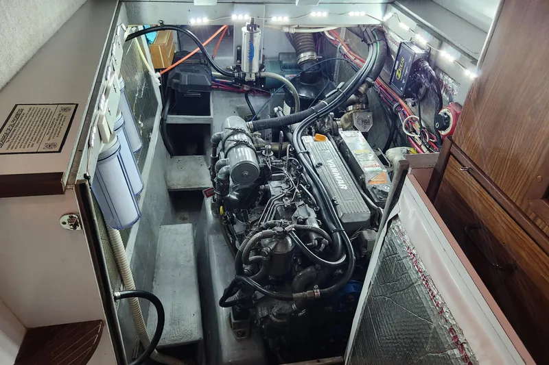Slide: The Image of Engine room of a 2003 Endeavour 44 TrawlerCat with visible Yanmar engine components. - 71