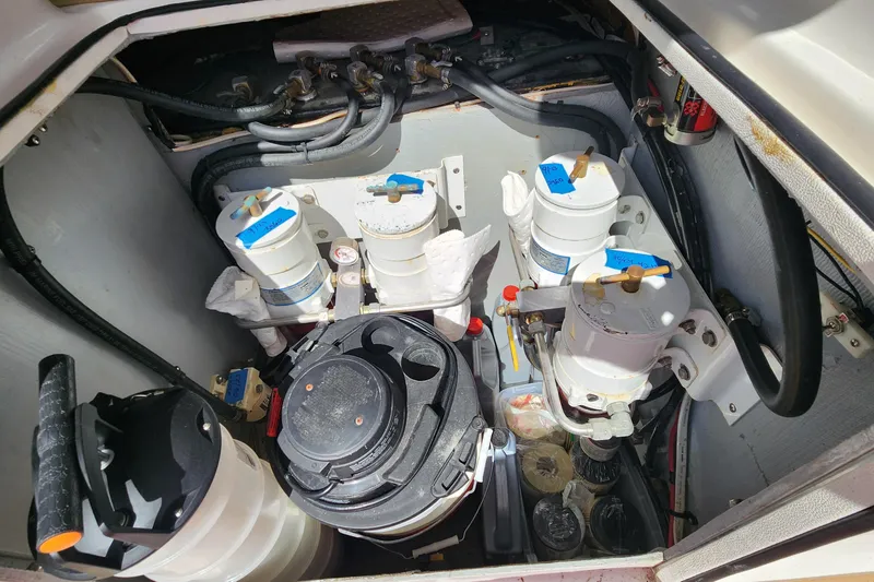Slide: The Image of Engine compartment of 2003 Endeavour 44 TrawlerCat with fuel filters and hoses. - 72
