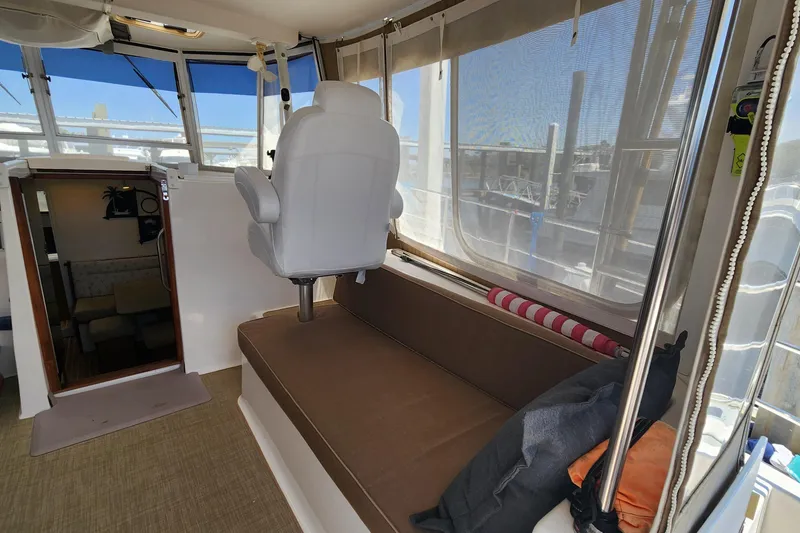 Slide: The Image of Interior of 2003 Endeavour 44 TrawlerCat with seating and helm chair. - 9