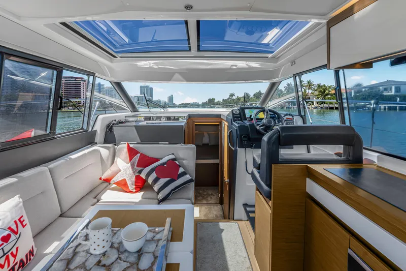 Slide: The Image of Interior of 2020 Jeanneau NC 37 yacht with modern design and scenic water view. - 14