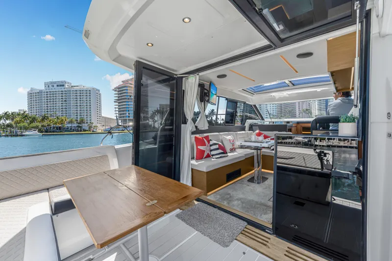 Slide: The Image of Interior view of 2020 Jeanneau NC 37 yacht with modern design and waterfront cityscape. - 17