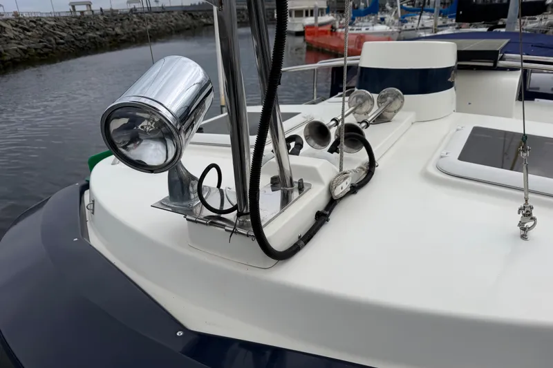 Slide: The Image of 2014 Ranger Tugs R-25 SC boat deck with spotlight and horns in marina. - 14