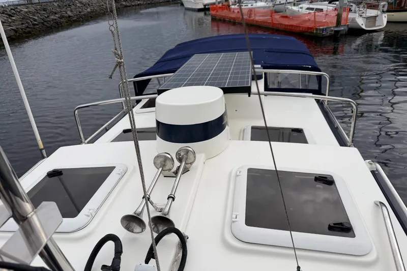 Slide: The Image of 2014 Ranger Tugs R-25 SC boat with solar panel on deck, docked in marina. - 15