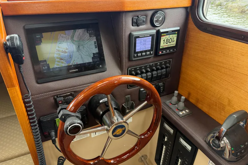 Slide: The Image of 2014 Ranger Tugs R-25 SC helm with Garmin navigation and control panel. - 30