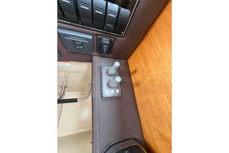 Slide: The Image of Control panel of 2014 Ranger Tugs R-25 SC boat with switches and buttons. - 32