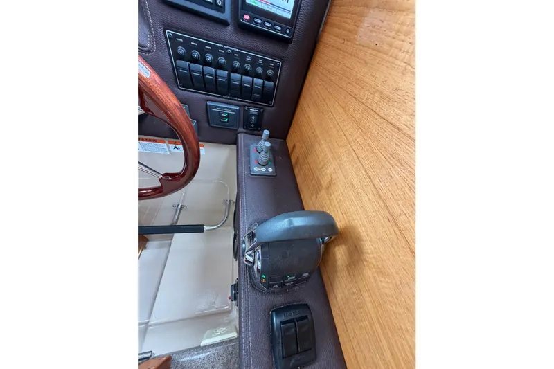 Slide: The Image of 2014 Ranger Tugs R-25 SC helm controls with joystick and switches. - 33