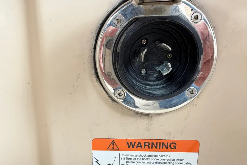 Slide: The Image of Close-up of a 2014 Ranger Tugs R-25 SC boat's power socket with warning label. - 40