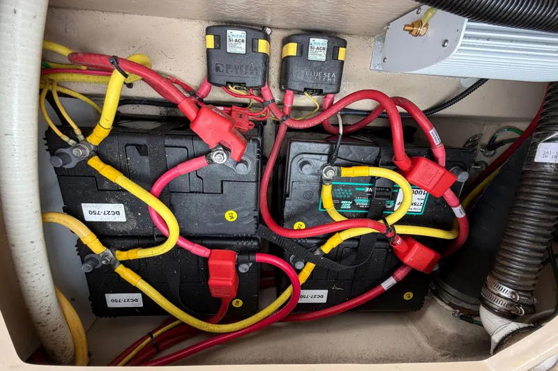 Slide: The Image of Battery compartment of a 2014 Ranger Tugs R-25 SC with wiring and connectors. - 44
