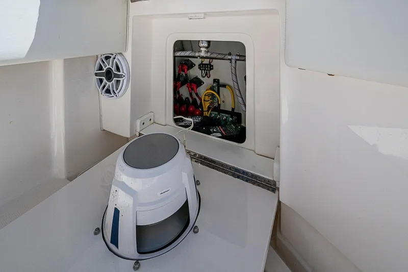 Slide: The Image of 2023 SeaVee 390B boat interior showing speaker and storage compartment. - 13