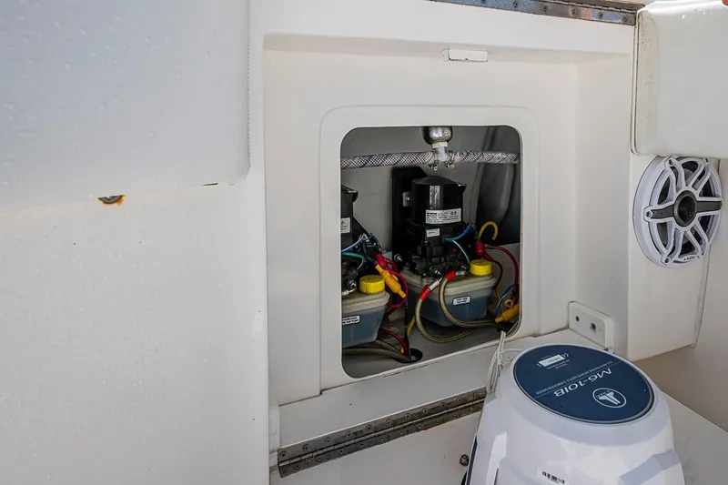 Slide: The Image of 2023 SeaVee 390B boat interior showing electrical components and wiring. - 14