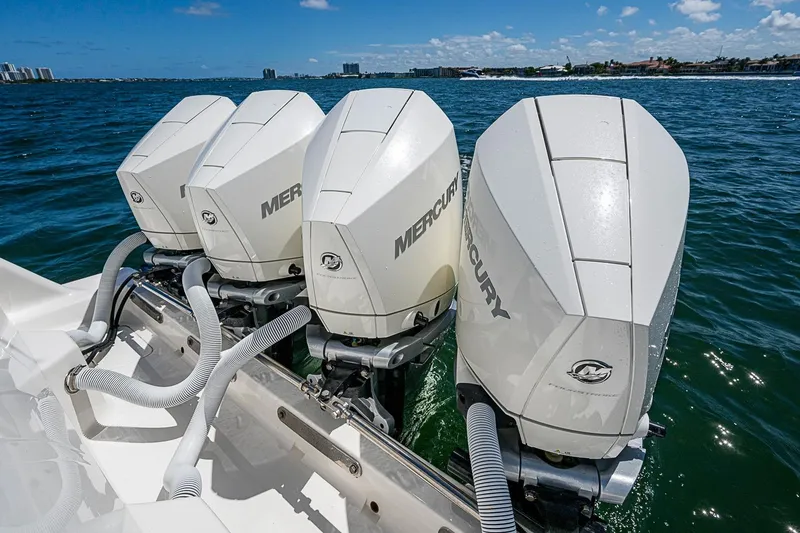 Slide: The Image of Four Mercury outboard engines on a 2023 SeaVee 390B boat in open water. - 15