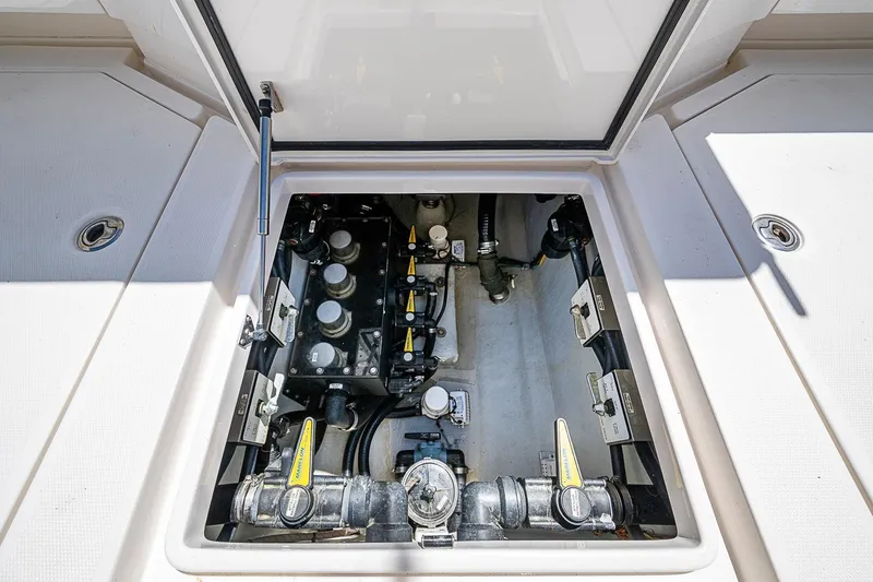 Slide: The Image of Engine compartment of 2023 SeaVee 390B boat, showcasing mechanical components and systems. - 16