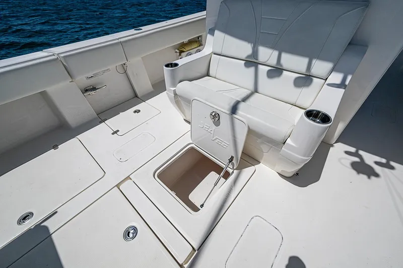 Slide: The Image of 2023 SeaVee 390B boat deck with storage compartment and seating. - 18