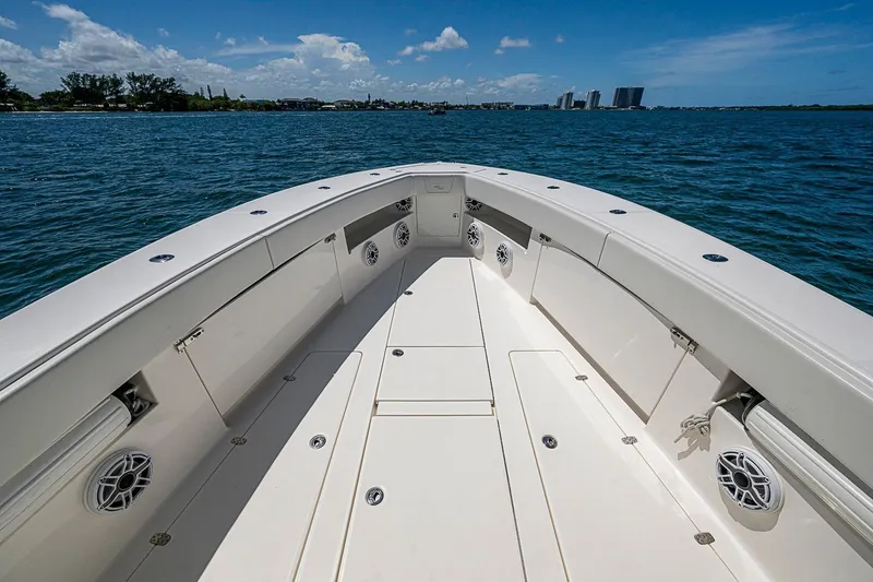 Slide: The Image of 2023 SeaVee 390B boat deck with ocean view and clear sky. - 2